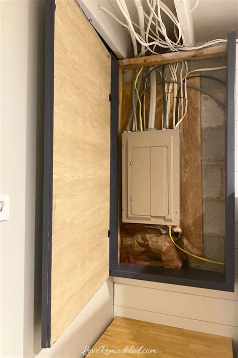 how to cover electrical box in basement|hide electrical panel in basement.